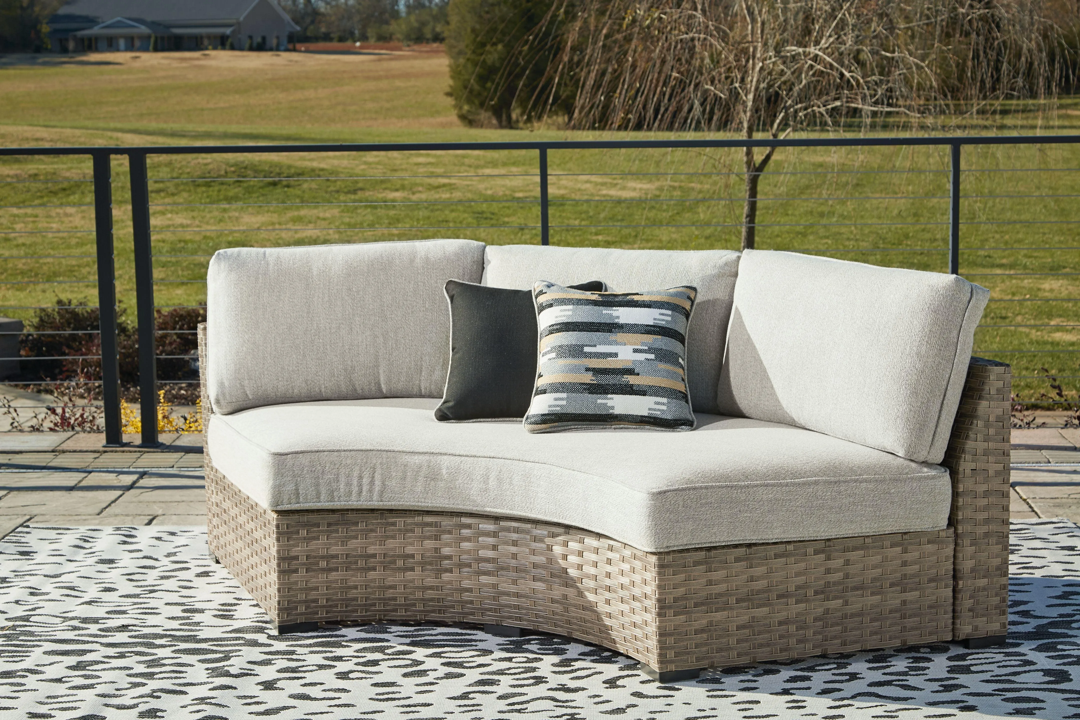 Calworth - Curved Loveseat With Cushion